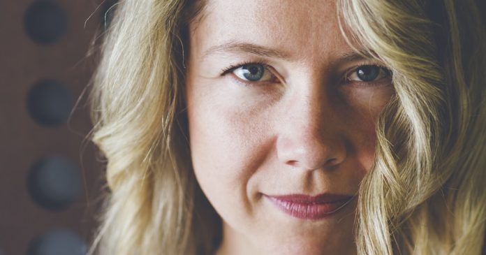 Close portrait of a woman with a calm direct gaze